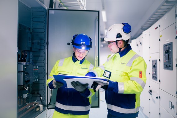 Technician and manager at work in industrial power center (1).jpg